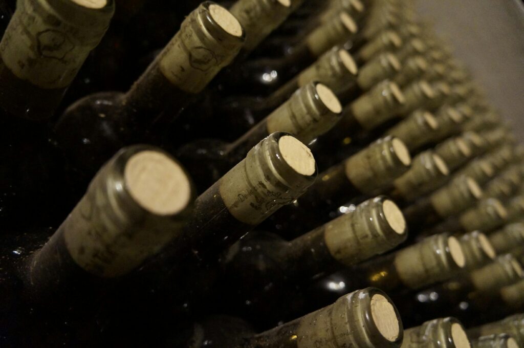 Wine bottles on a wine rack positioned on their side